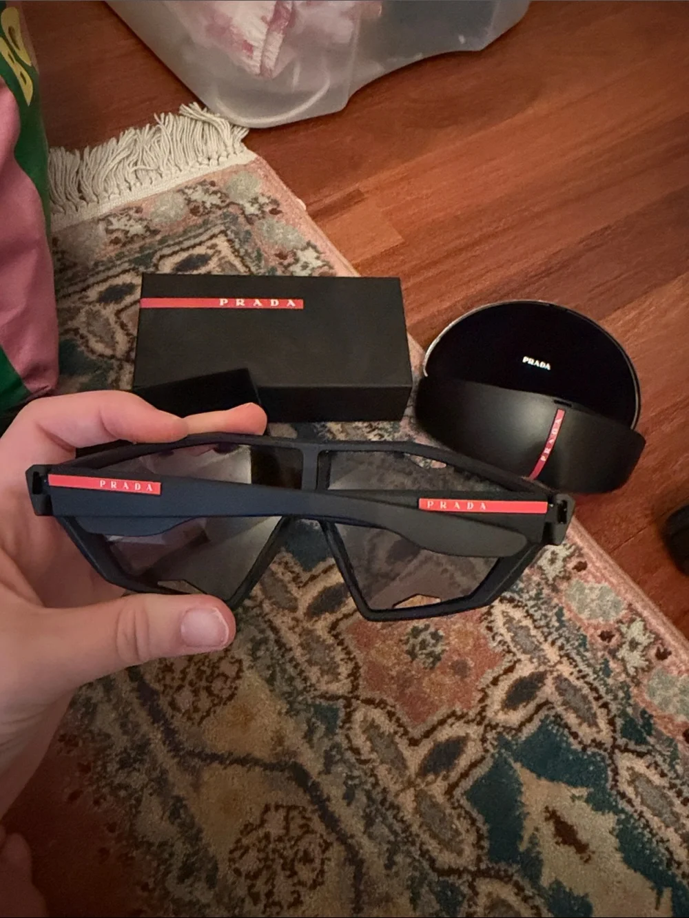 Prada Black Frame Sunglasses with Red Mirrored Lenses